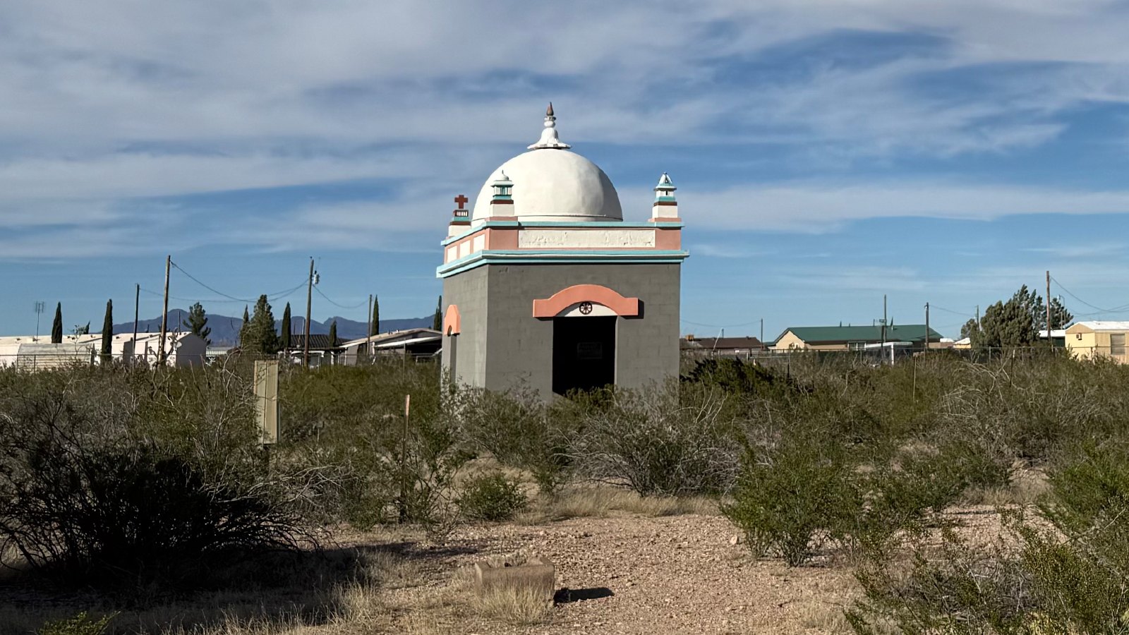The Shrine of the Avatar standing in desert scrub under a blue sky, Village of Columbus, New Mexico