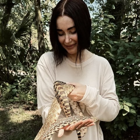 Misti Mendoza holding a snake